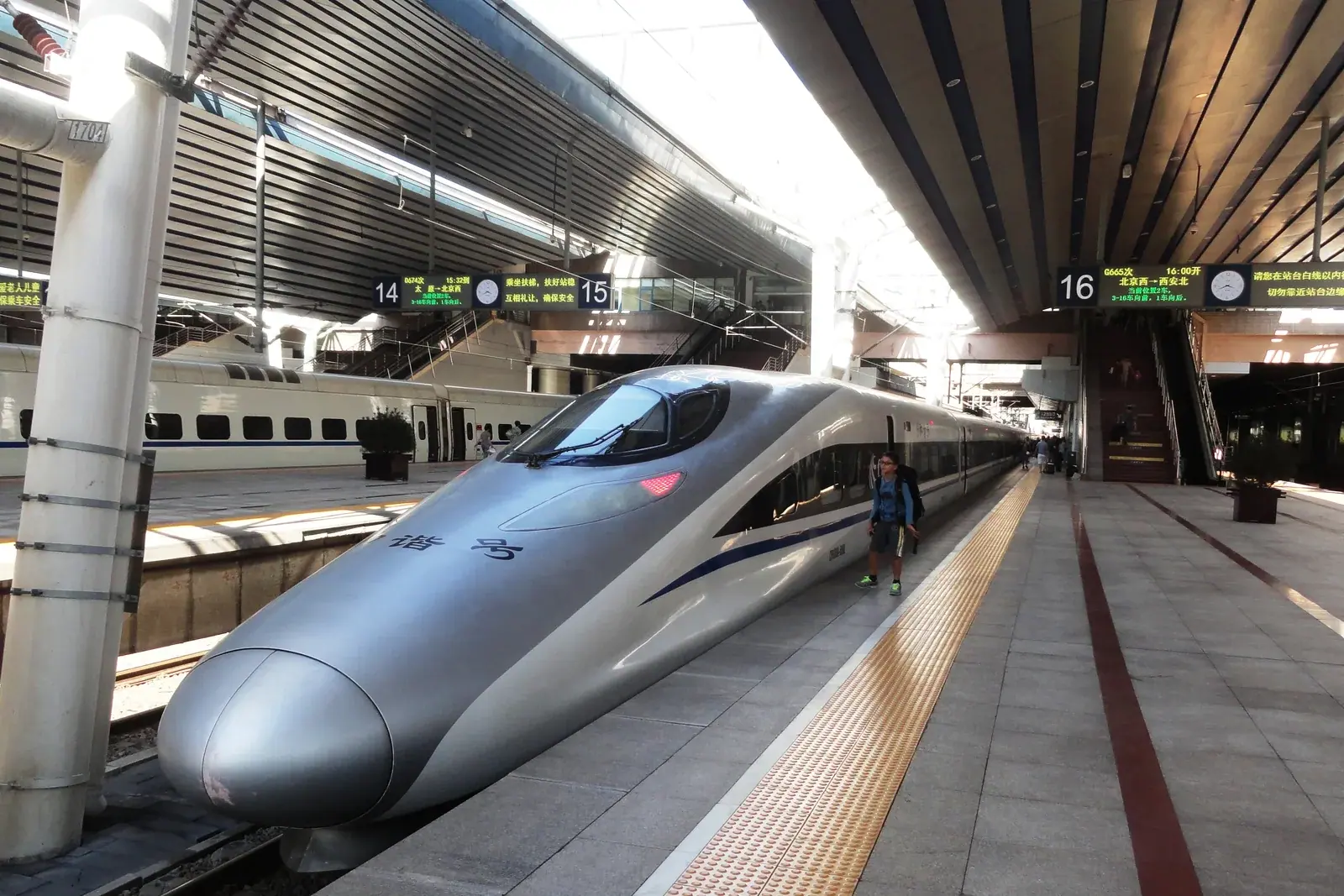 High-speed train waiting at a platform in Beijing West Railway Station