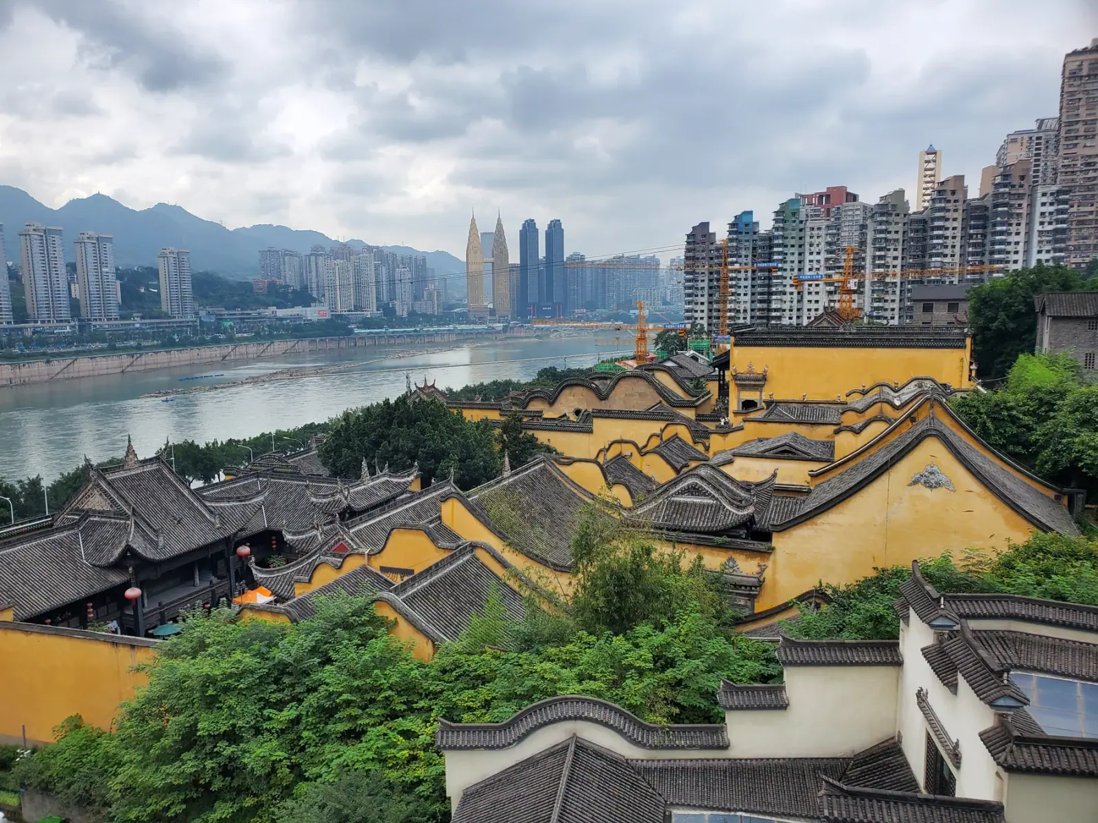 Decorated entrance and courtyard buildings at Huguang Guild Hall in Chongqing